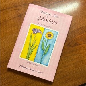 Between Sisters Hardcover Book